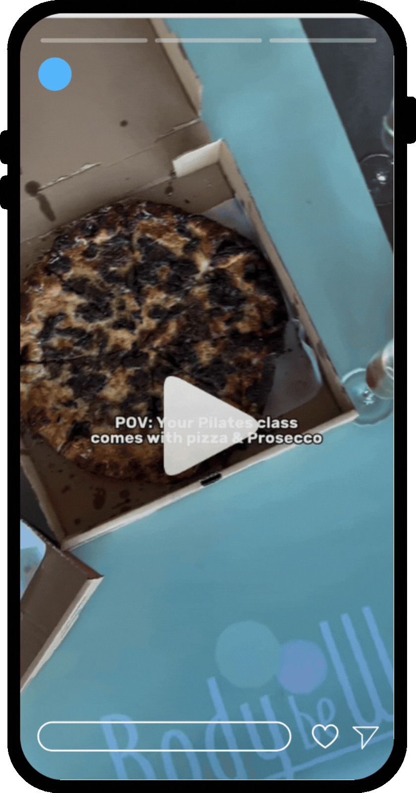 Phone mockup featuring an Instagram reel highlighting a pilates, pizza, and prosecco event