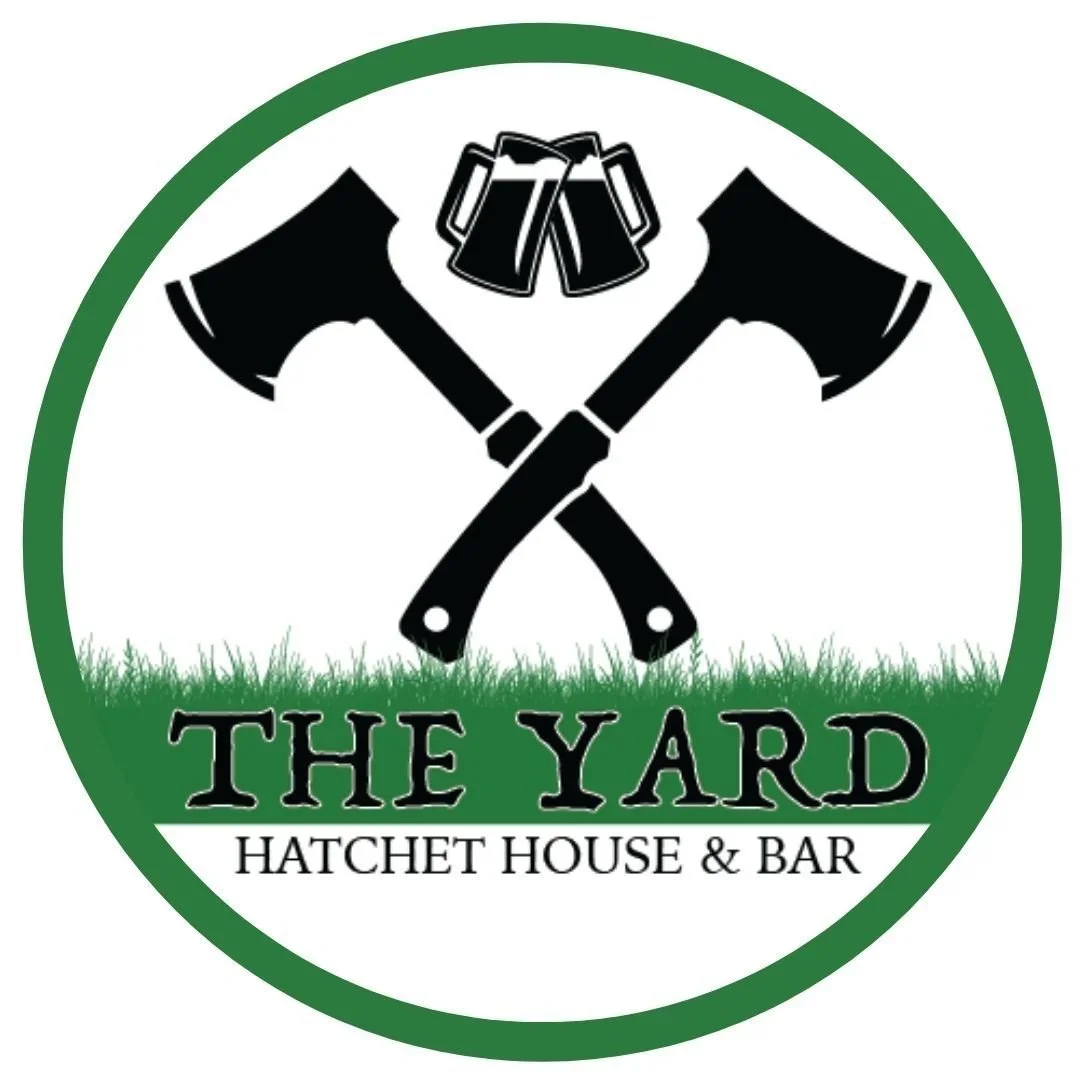 The Yard Hatchet House and Bar logo, with The Yard written on a grass background and two hatchets in a criss-cross pattern above it