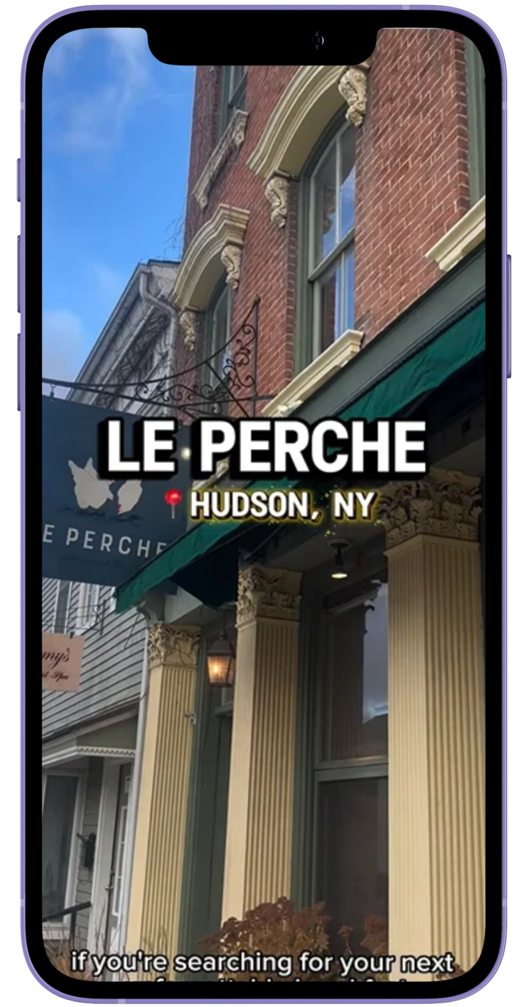 Phone mockup of an Instagram reel featuring Le Perche, a cafe inside of a red brick building in Hudson NY