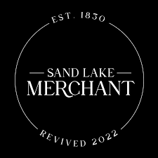 Logo with circular design featuring text about Sand Lake Merchant, established in 1850 and revived in 2022.