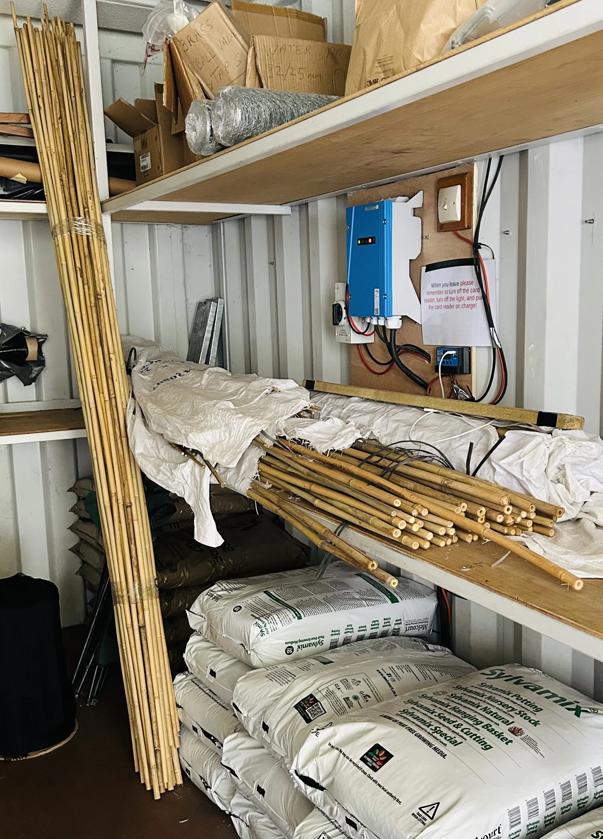 Allotment shop offering garden supplies, mesh, potting soil, compost, bamboo stakes, and general consumables for plot holders