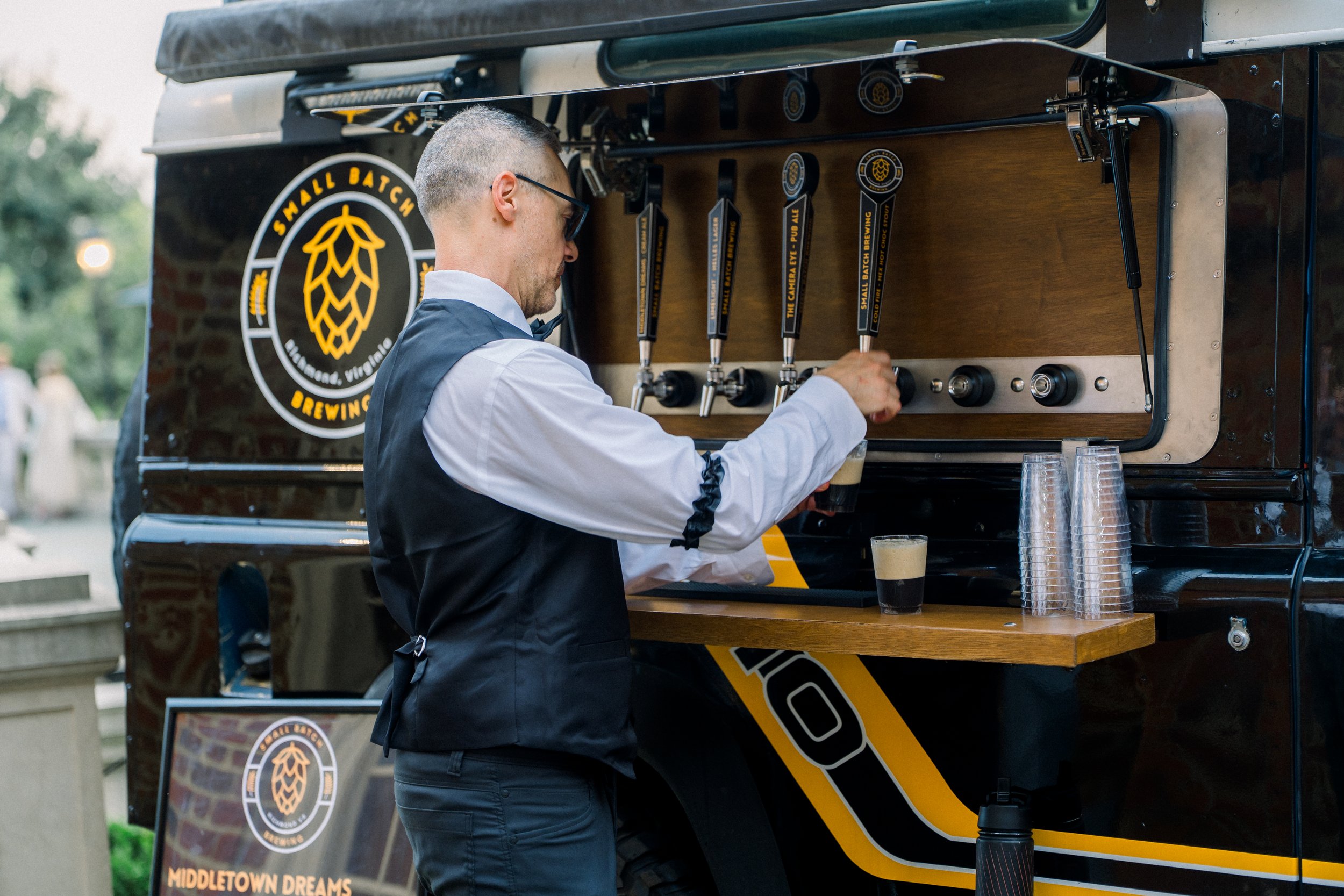 Bartender serving guests from Monty, a Richmond mobile bar and tap truck