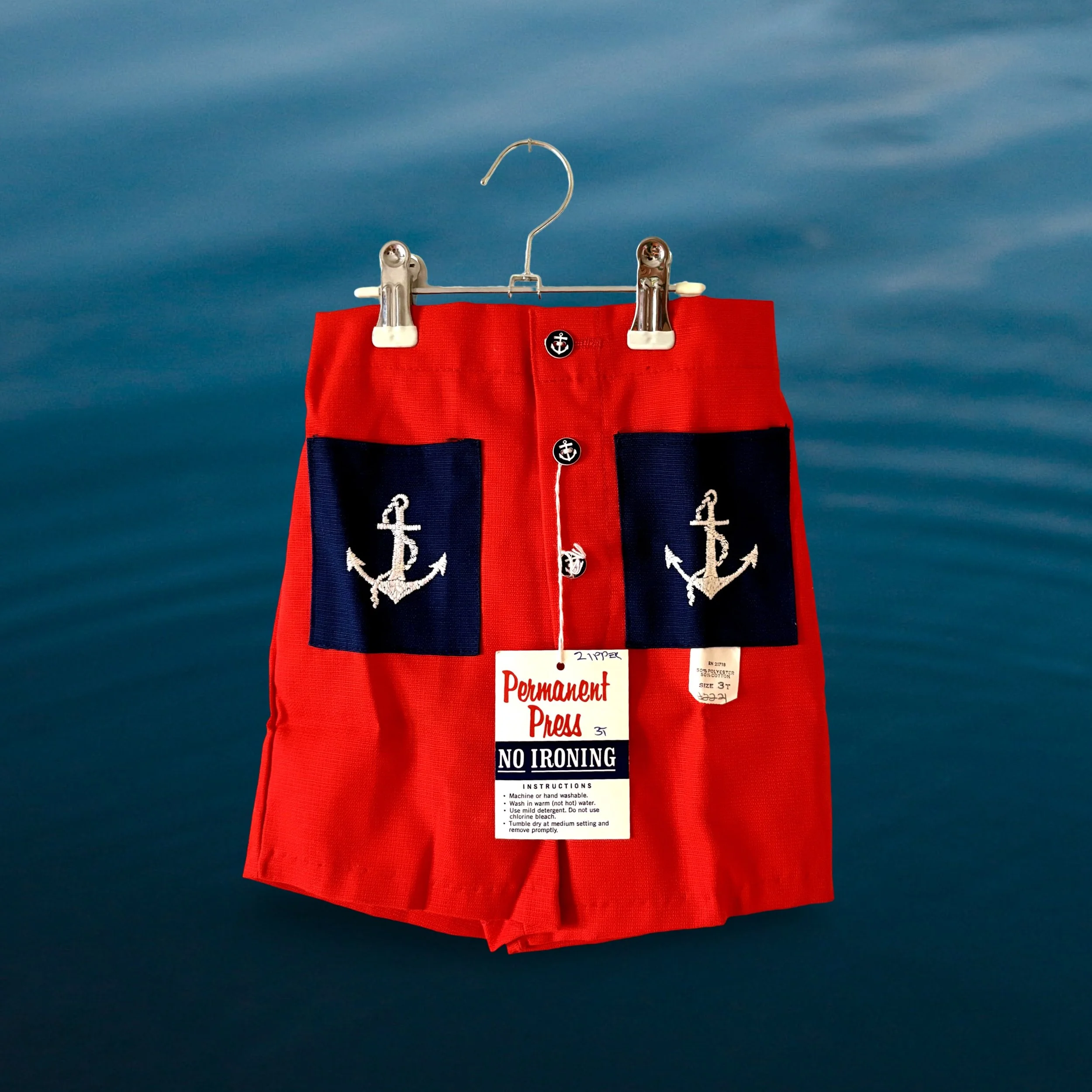 Red, navy-blue embroidered sailor anchor shorts