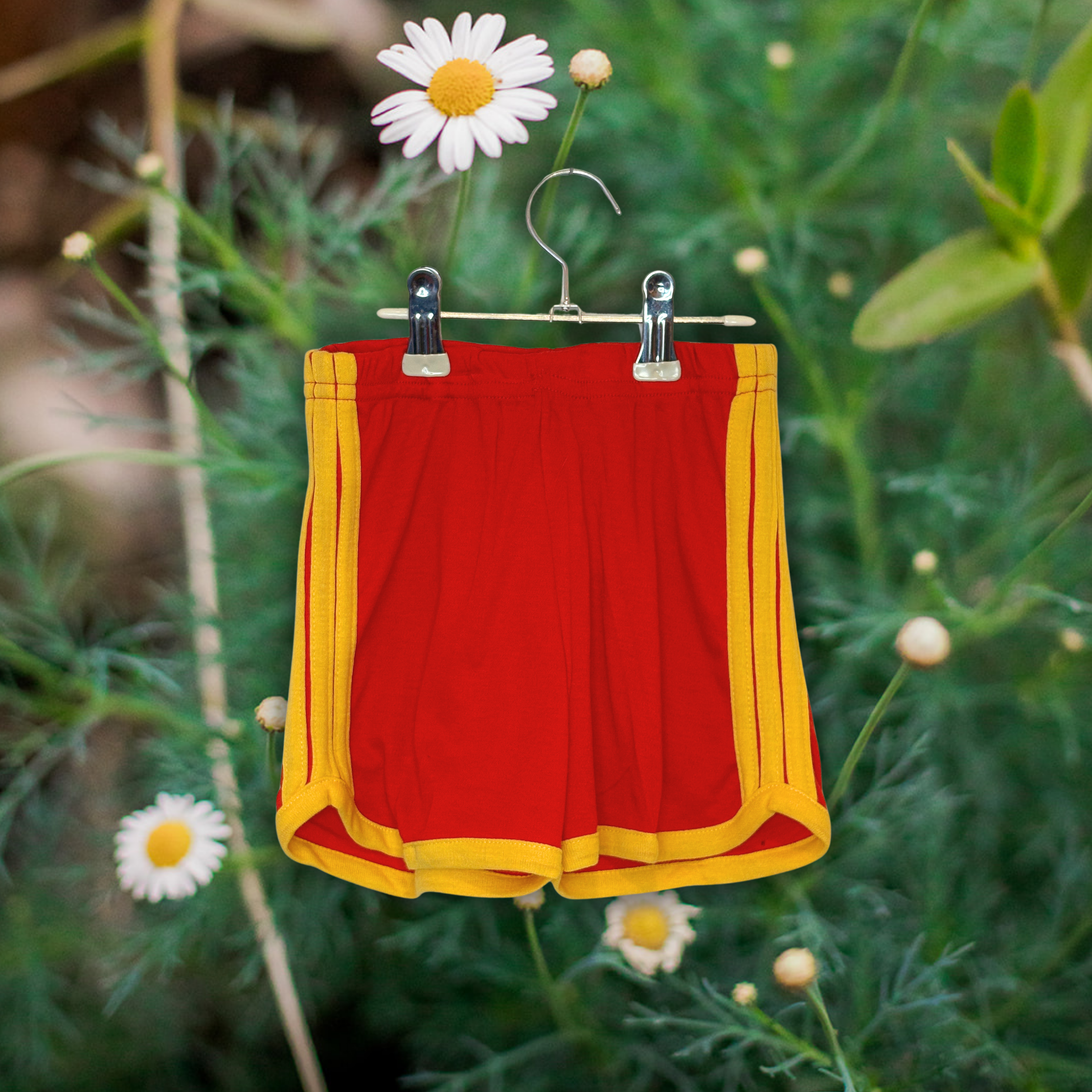 Red track shorts with yellow side stripes/trim
