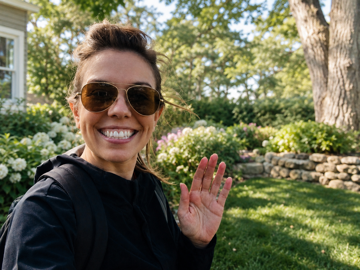 Shannon, owner of Saint Cloud Home & Garden, standing in a garden in West Orange, New Jersey.