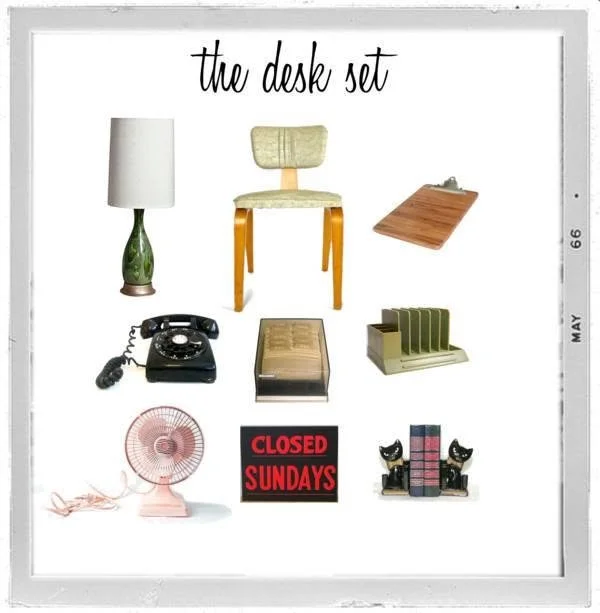 A collection of vintage office desk items including a lamp, chair, desk pad, rotary phone, file organizer, desk fan, 'Closed Sundays' sign, and bookends with books.