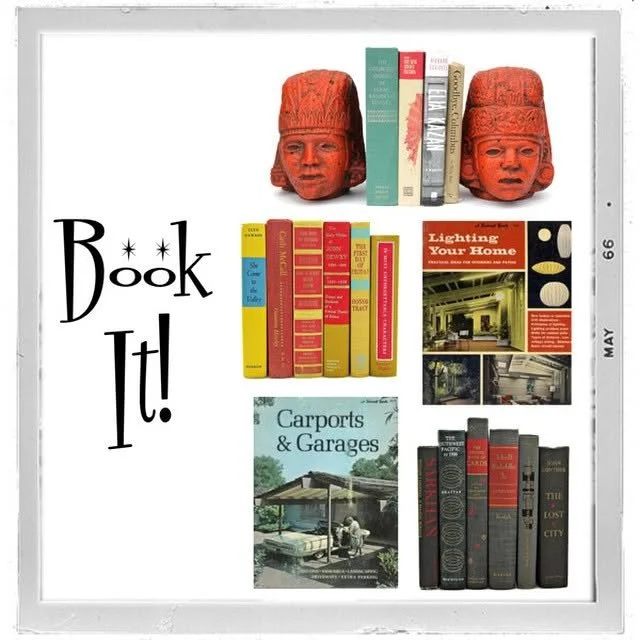 Display of books and decorative items on a wall with the phrase "Book It!" written in black, featuring two red tribal-style masks at the top, and organized into five sections including books on home lighting, carports and garages, and a collection of black and red books.