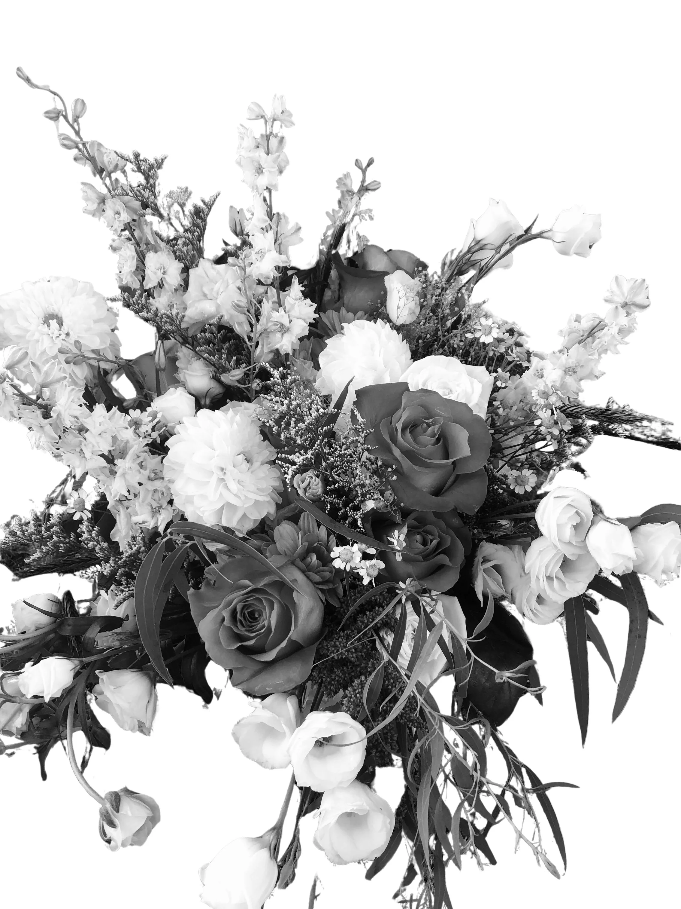 A black-and-white photo of a large floral bouquet including roses, and various smaller flowers, with greenery.
