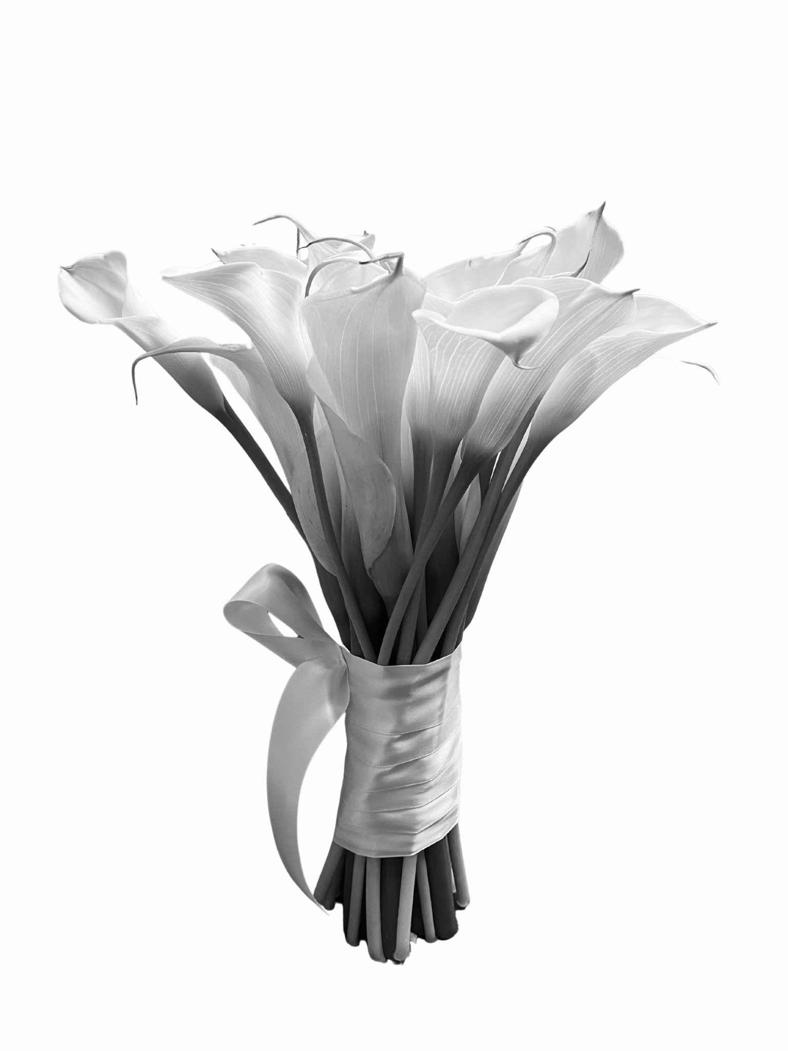 Black and white photo of a bouquet of calla lilies wrapped in a ribbon.