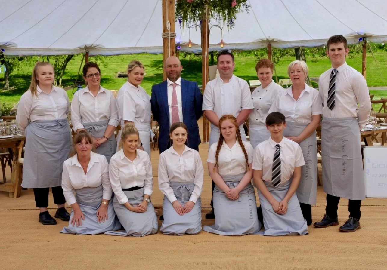 The Jeeves Catering team at a wedding event in a marquee