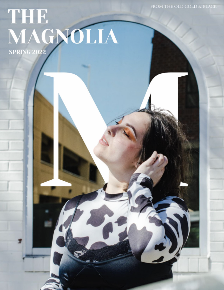 The Magnolia Spring 2022 magazine cover featuring a woman in a cow-print top and black dress posing in front of an arched window.