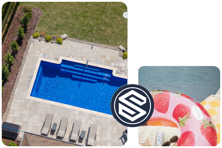 A top-down view of a backyard swimming pool with four lounge chairs around it, a grassy area, and a strawberry-patterned pool float in the water.