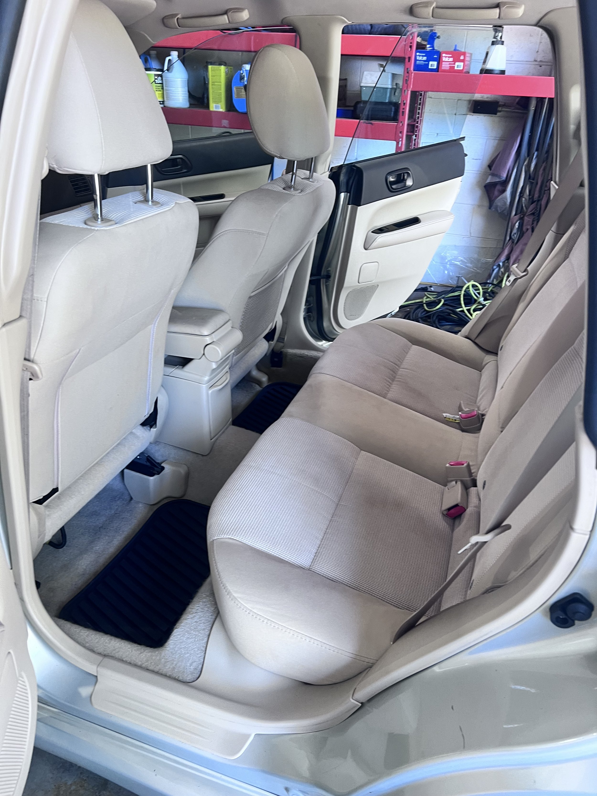 Completion detail — Clean upholstery, carpet, and interior surfaces documented after service.
