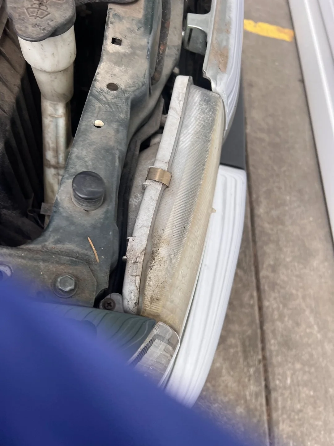 Cowl-area water-leak diagnosis — Cowl seam and surrounding panels exposed for inspection.