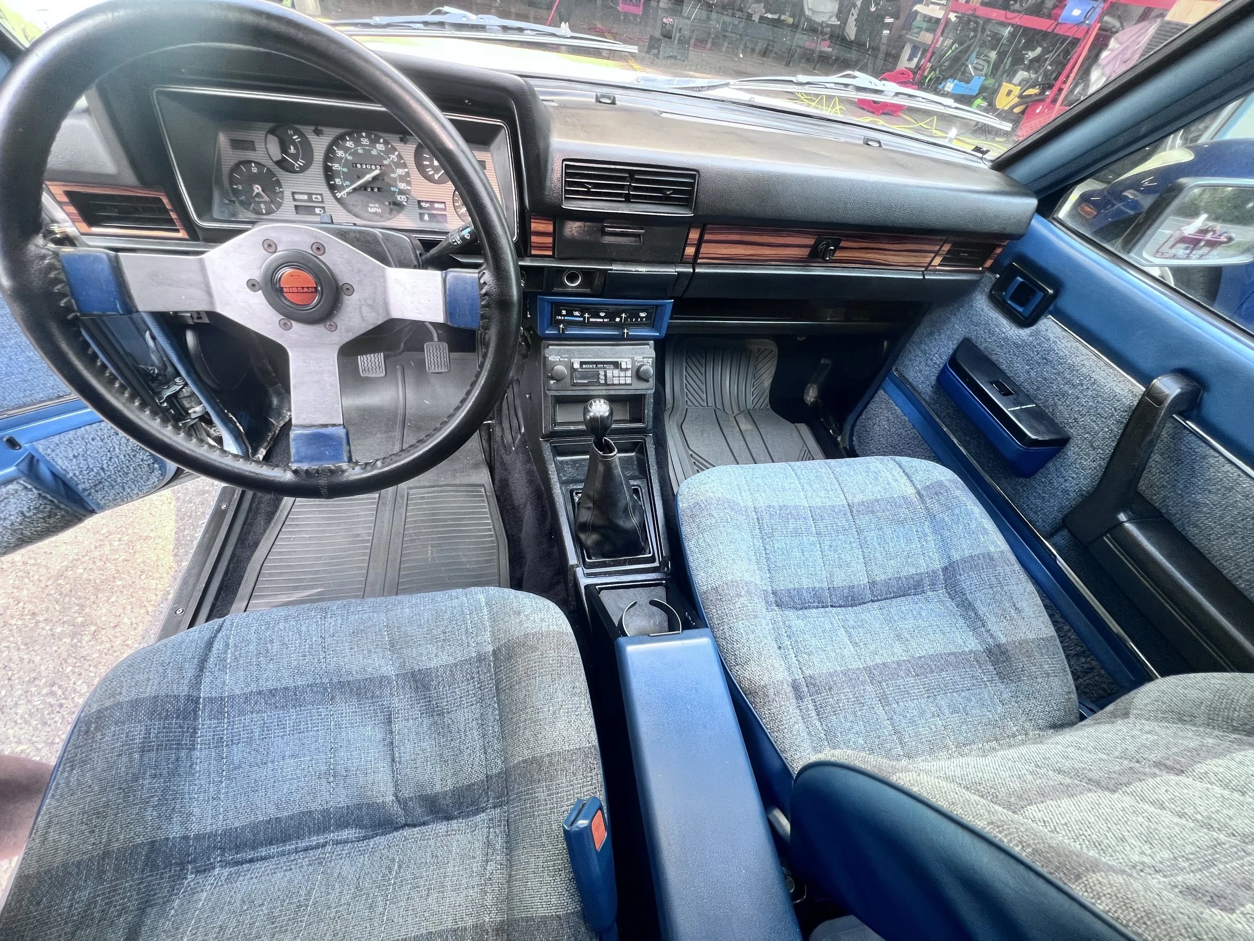 Interior detail — Dashboard, controls, upholstery, and trim documented after service.
