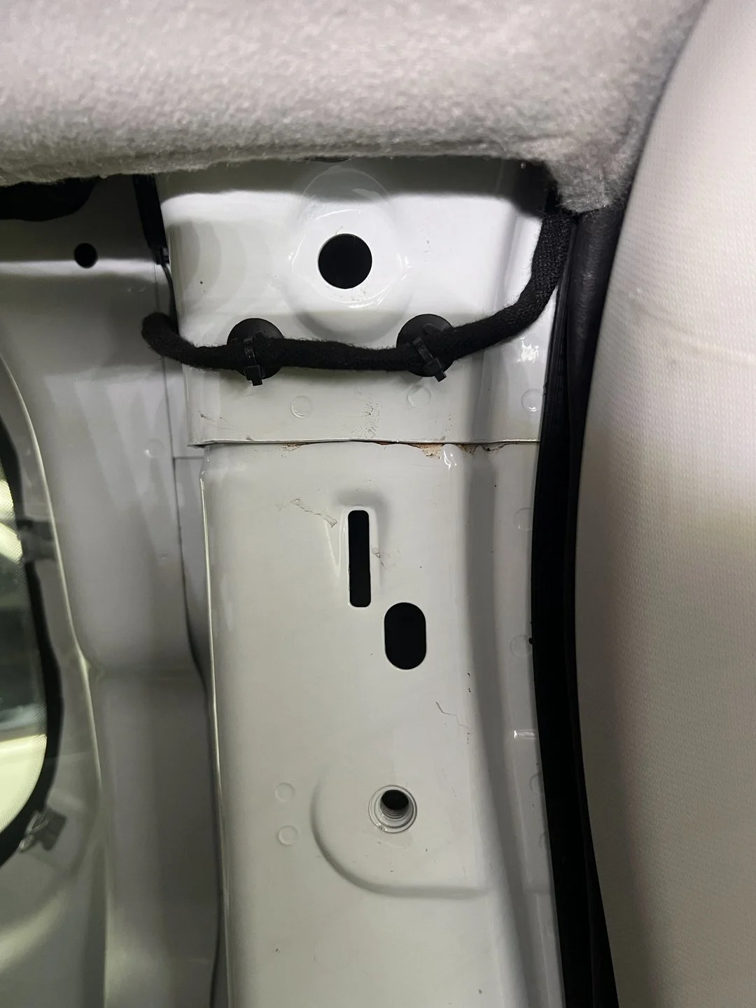 Rear-body water-leak diagnosis — Inner body opening exposed to verify where water traveled.
