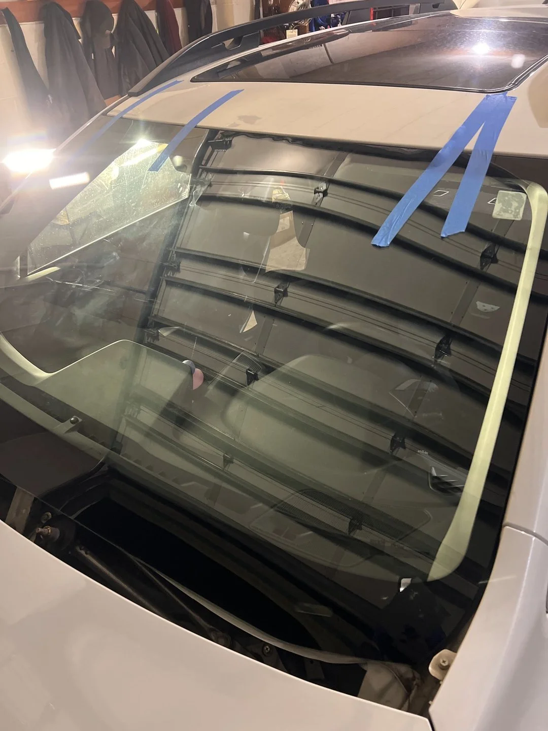 Rear-body water-leak diagnosis — Suspected rear-glass path marked before controlled testing.