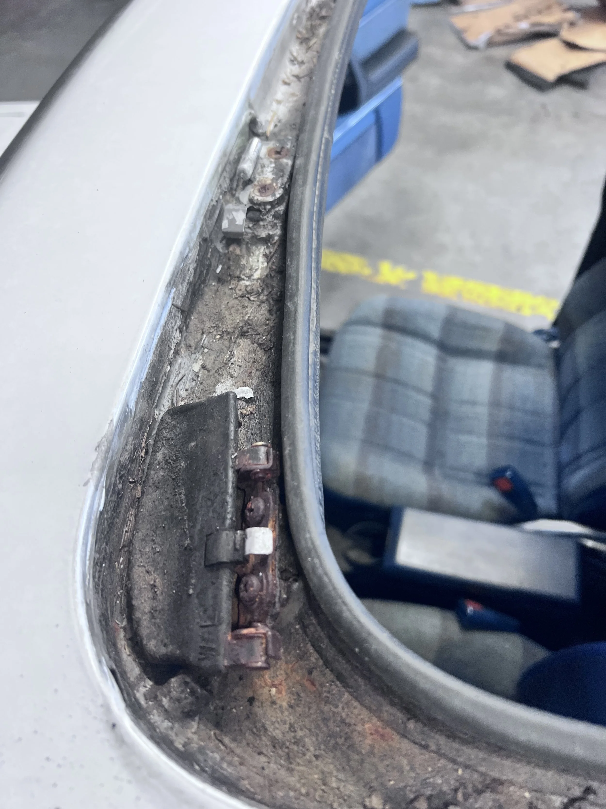 Failure evidence — Corrosion and contamination documented along the sunroof glass-frame channel.