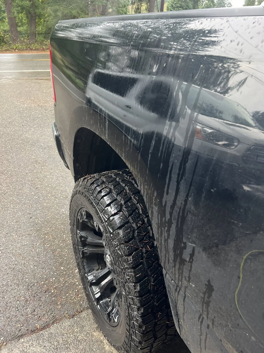 Rear-body water-leak diagnosis — Controlled exterior water test used to trace the vehicle’s entry path.