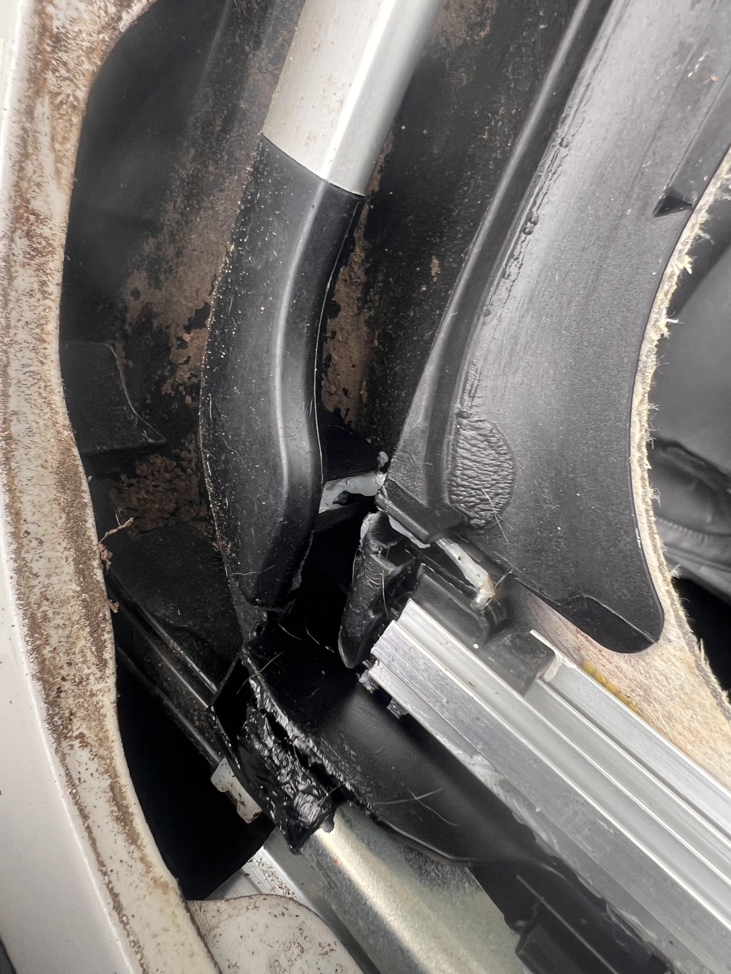 Source inspection — Sunroof cassette channel exposed with heavy contamination.
