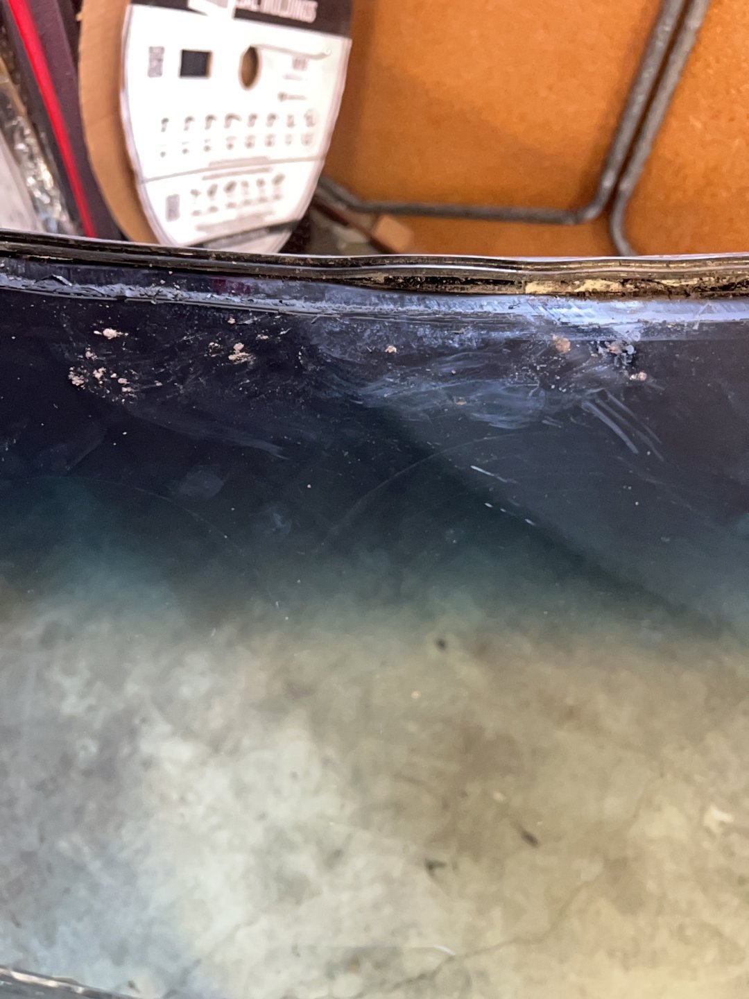 Windshield service — Pinchweld bonding surface cleaned and prepared for installation.