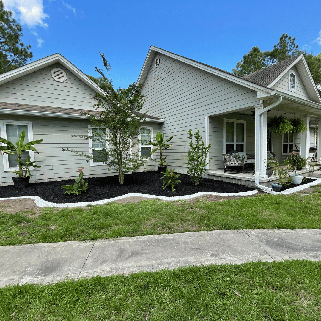Landscaping. Garden designed with plants and mulch install.