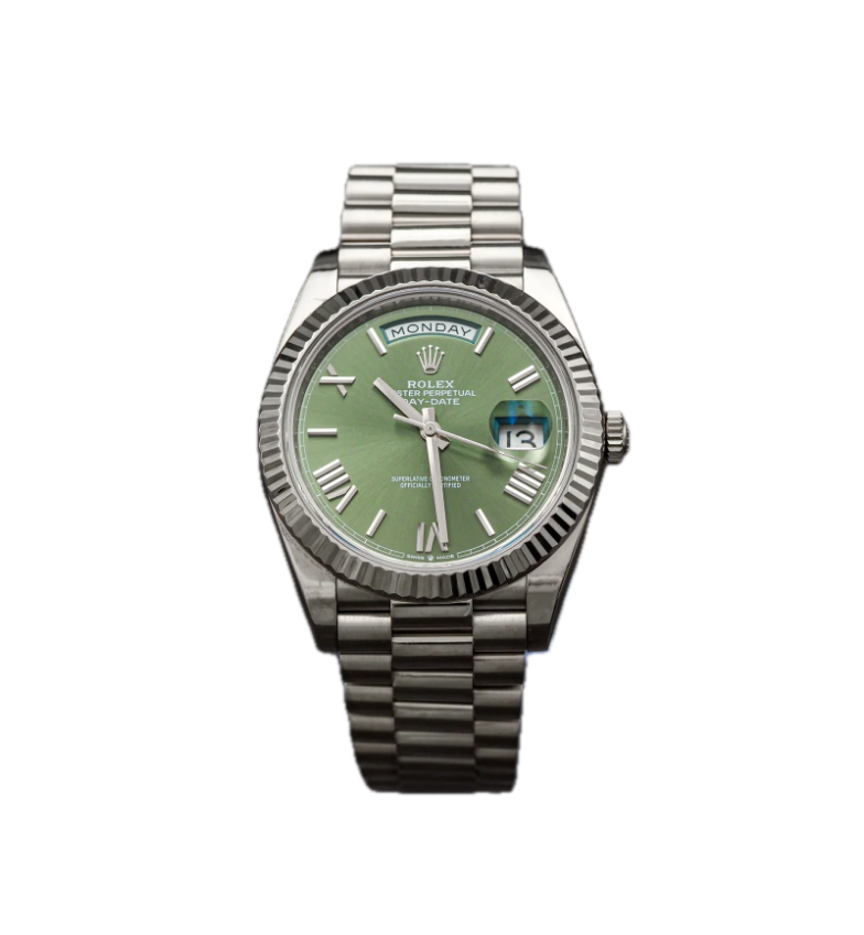 A Rolex wristwatch with a green dial, silver Roman numeral markers, day display at the 12 o'clock position, date window at the 3 o'clock position, and a silver bracelet.