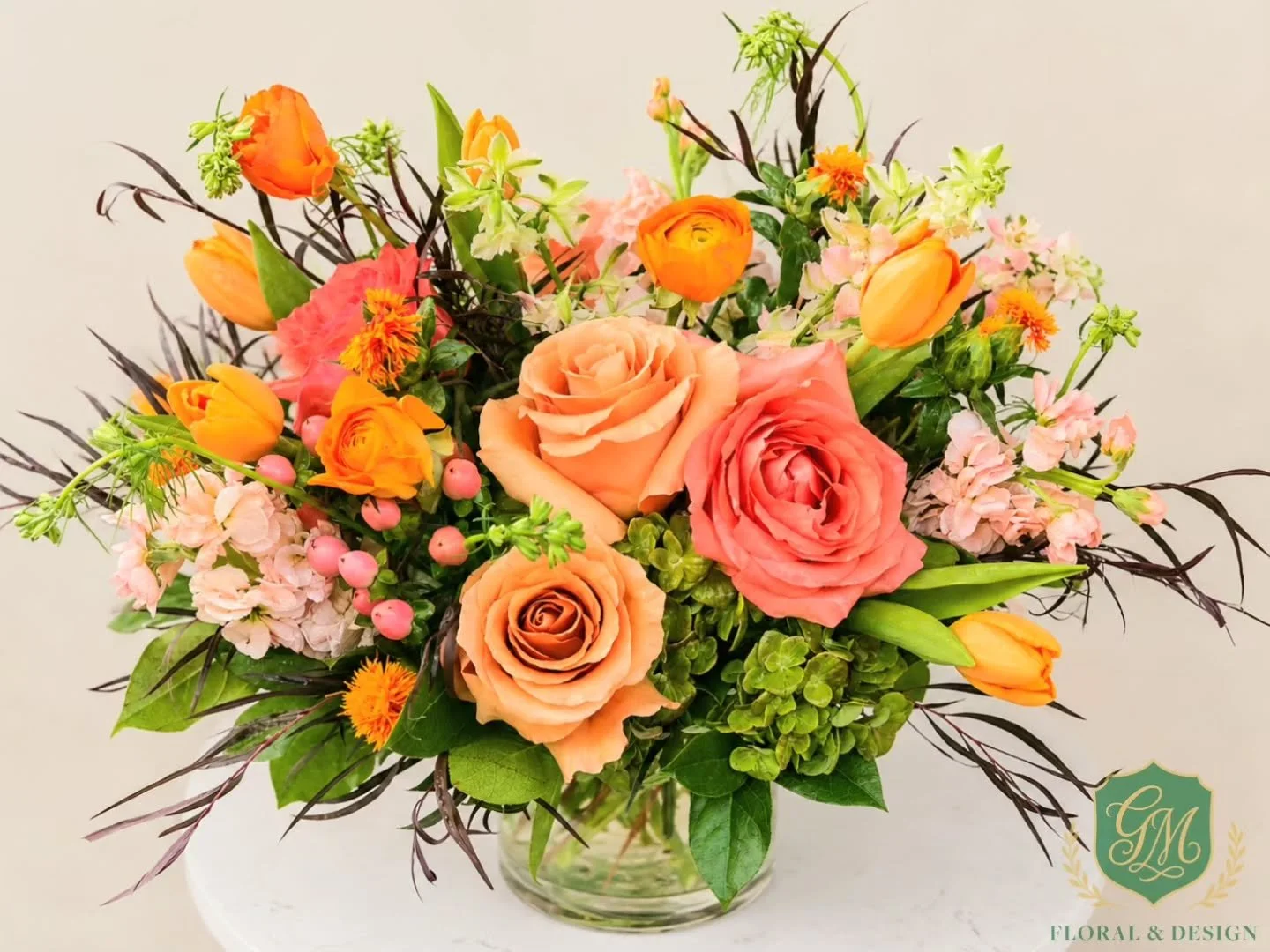 Fall may not officially be here just yet, but we couldn't wait. This one felt like a perfect transition arrangement..

We're slowly starting to work those rich fall colors and textures into our designs...and this mix of coral, peach, orange and fresh