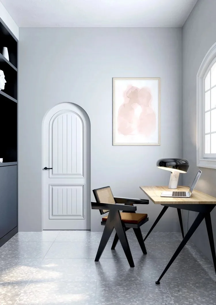 Home office with arched white door