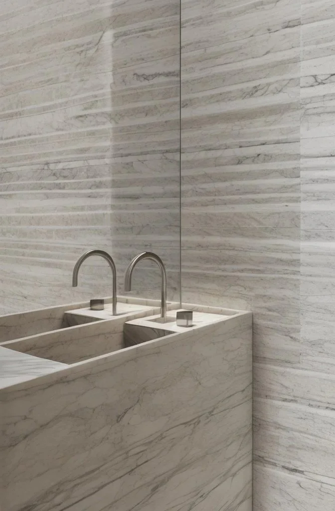 Marble spa sink detail with dual faucets