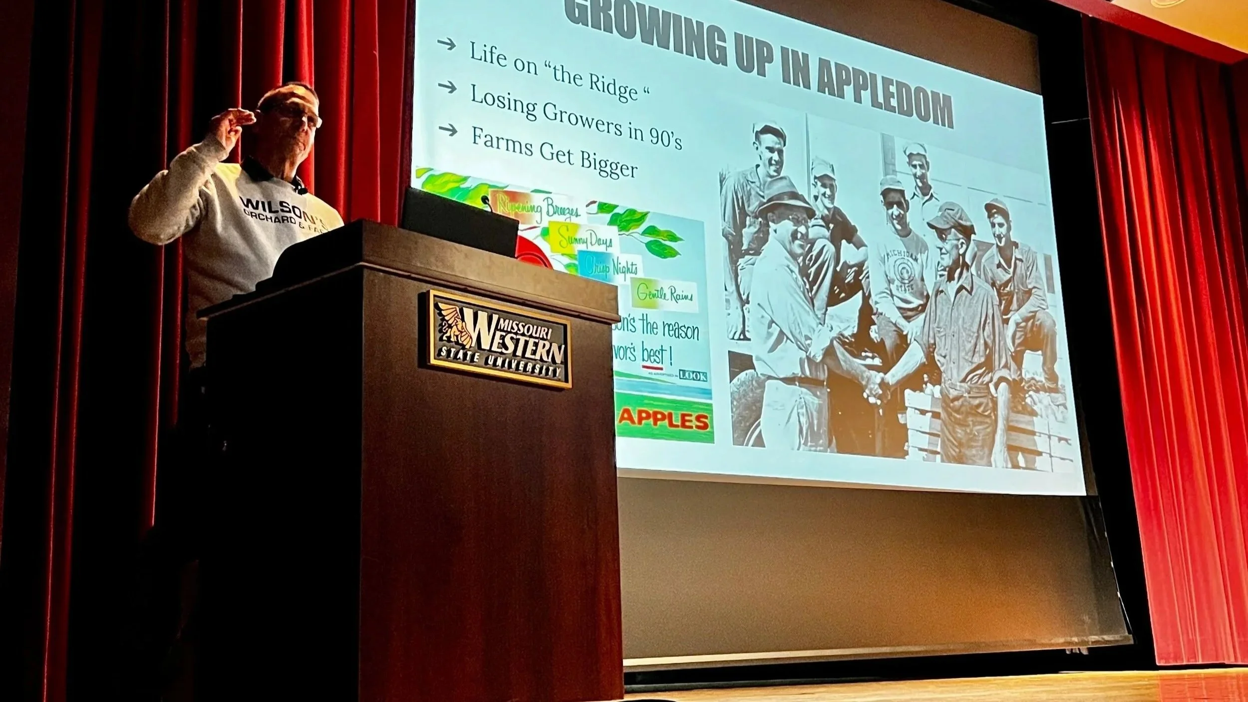 Image of a presenter next to a presentation.