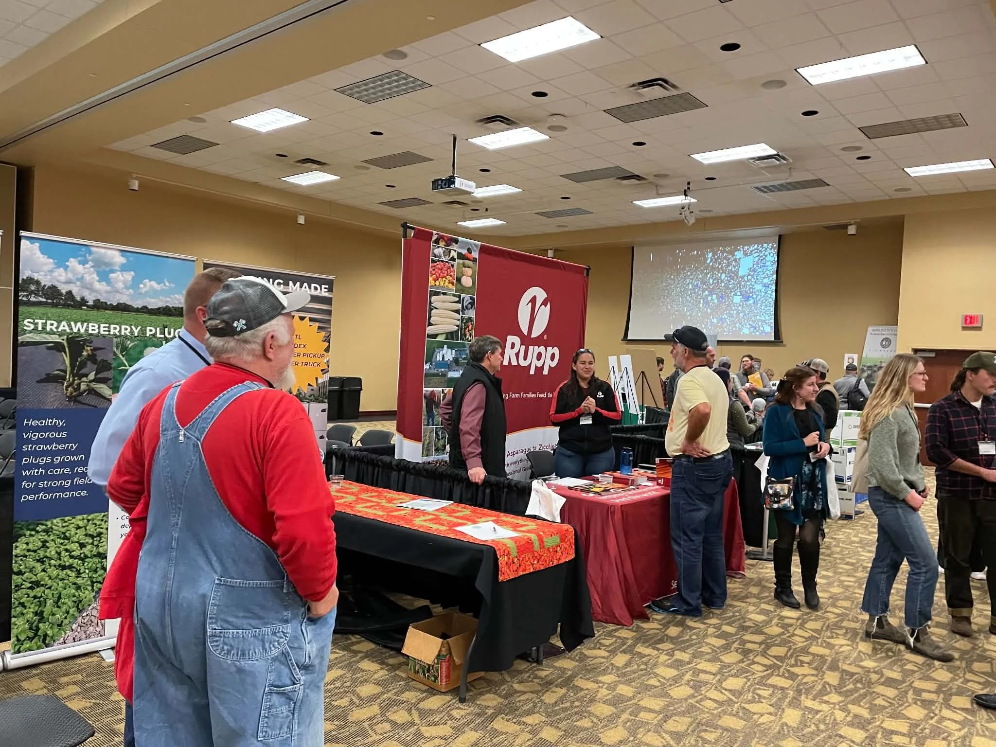 Attendees interact with vendors.