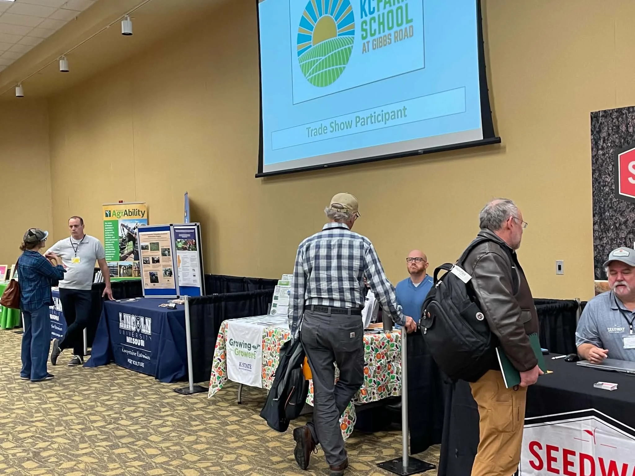 Attendees interact with vendors.