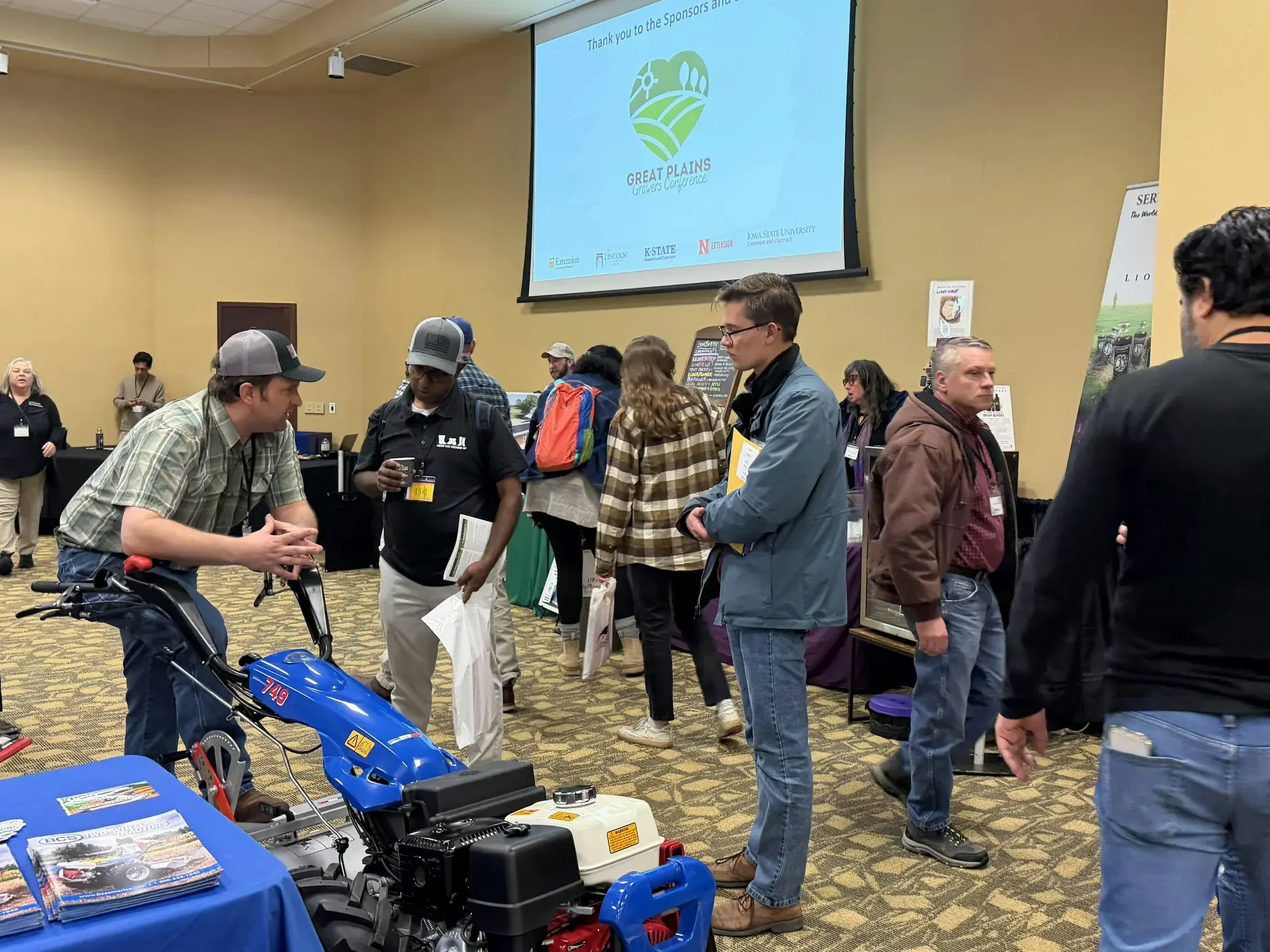 Guests interact with vendors at the trade show.