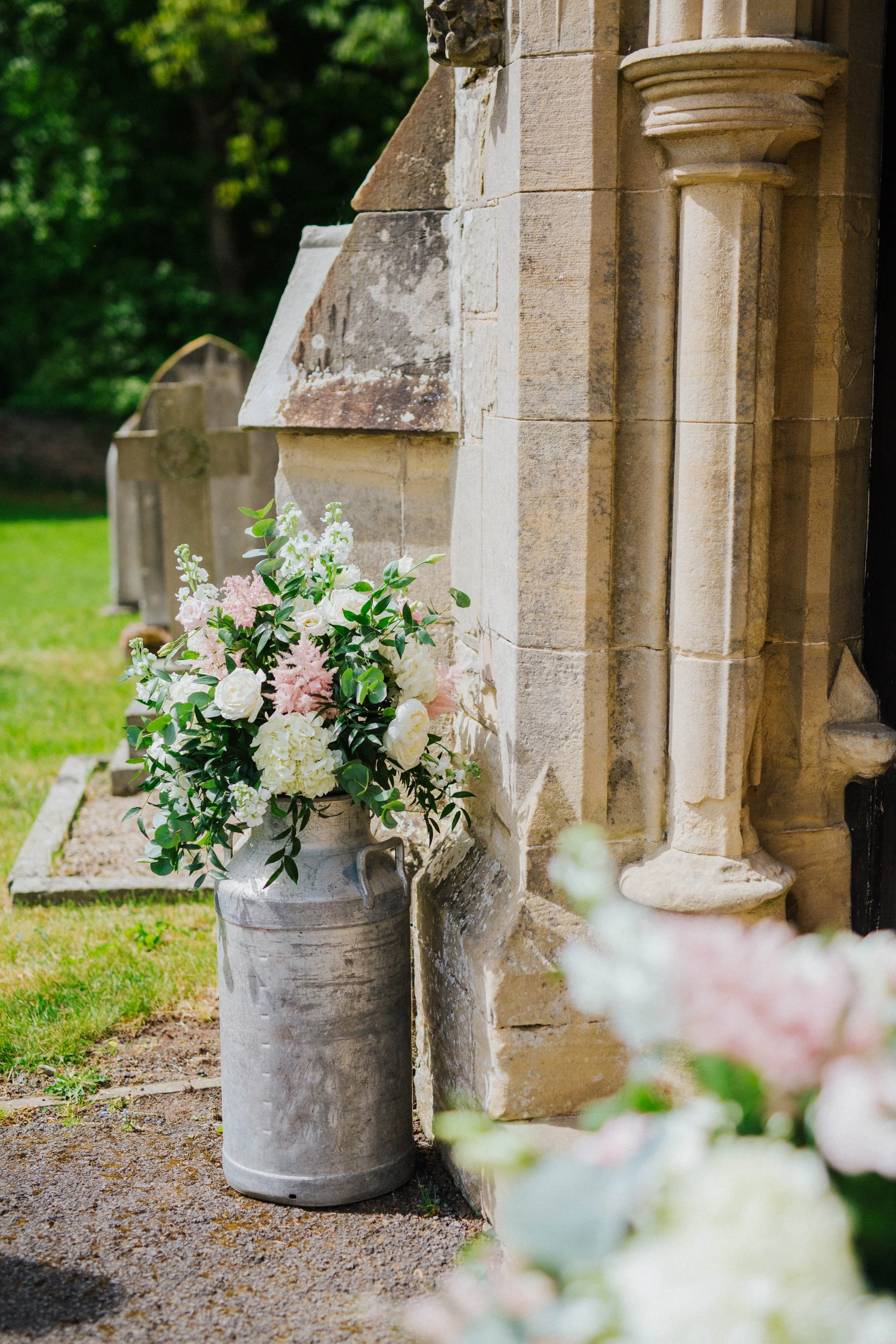 Milk churn wedding flowers at Lodge Farm Weddings Cundall 
