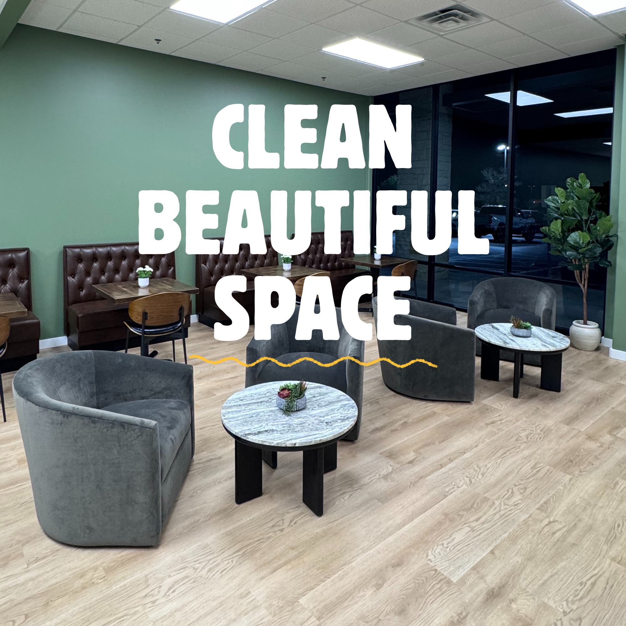 Interior of a coffee shop or restaurant with green walls, tufted leather booths, small tables with potted plants, and a large window showing a parking lot outside. Text overlay says "CLEAN BEAUTIFUL SPACE."
