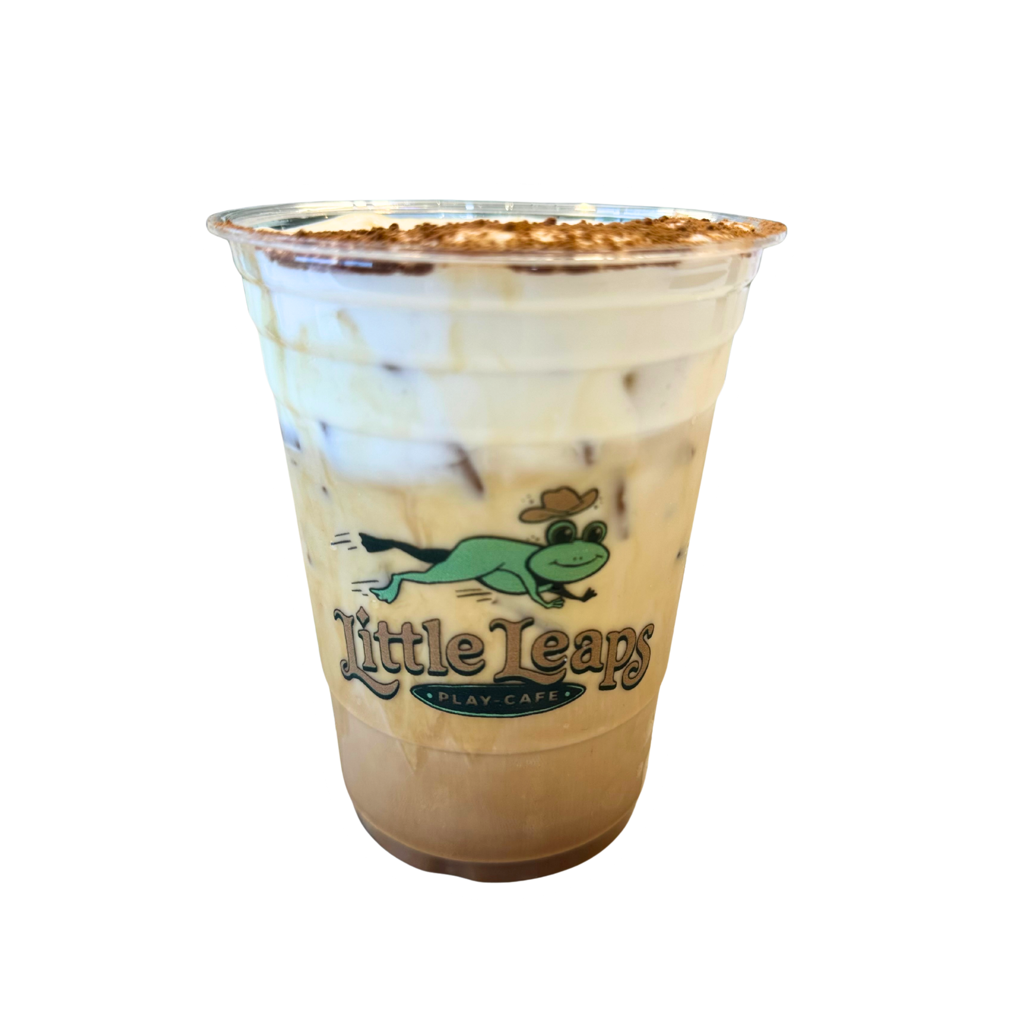 A caramel frappuccino in a clear plastic cup with a cartoon crocodile on it, topped with whipped cream and sprinkled cocoa powder.