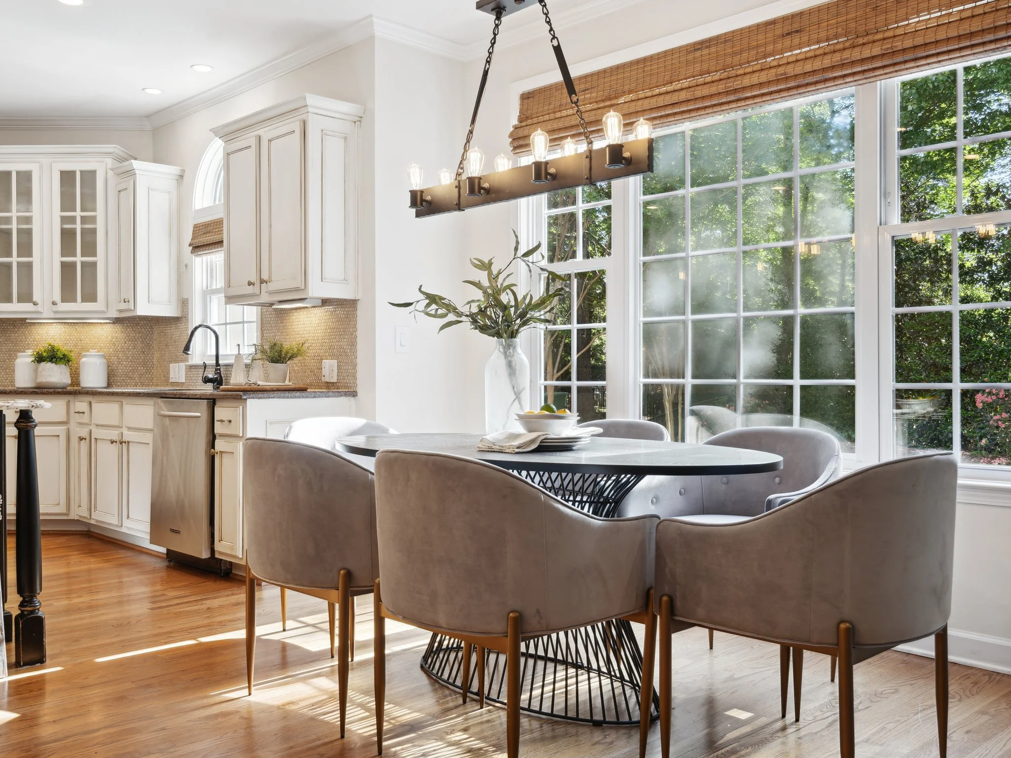 Staged dining and kitchen space with natural light, Designs Unlimited Staging
