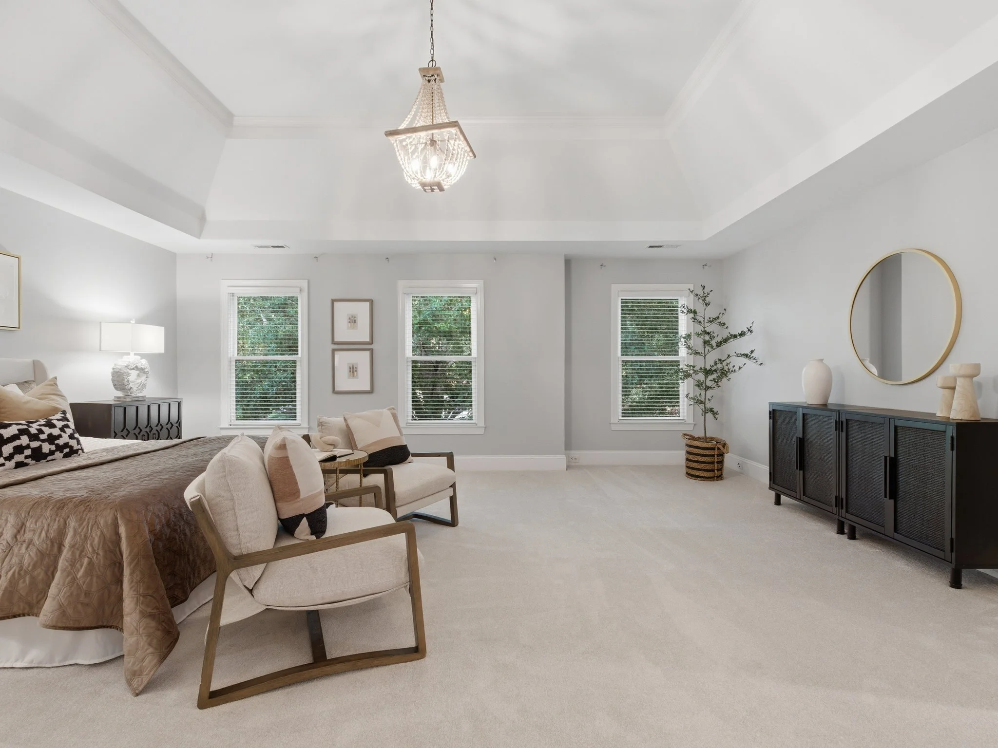 Staged primary bedroom with sitting area, Charlotte NC