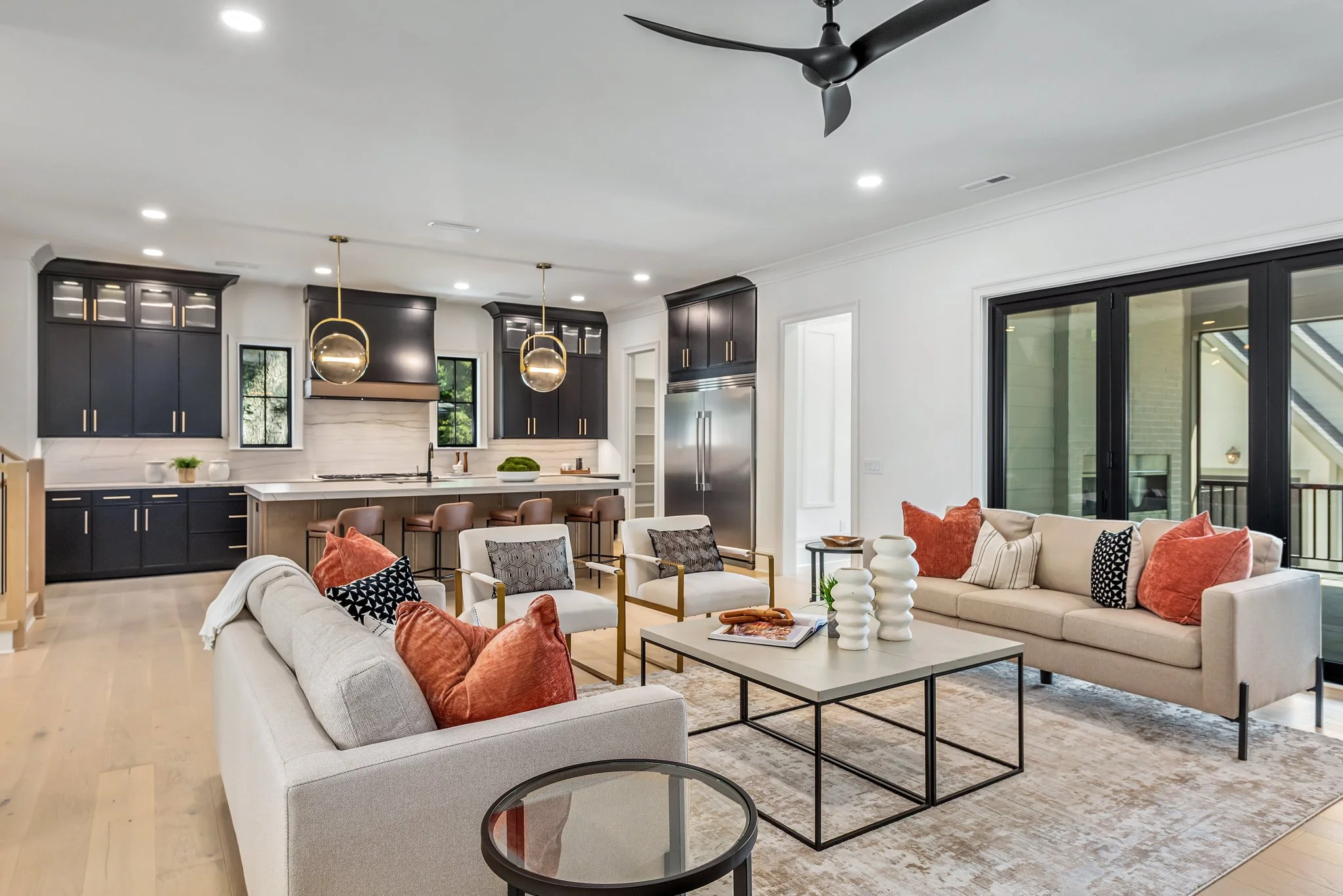 Staged great room and kitchen with bold black cabinetry, Charlotte NC
