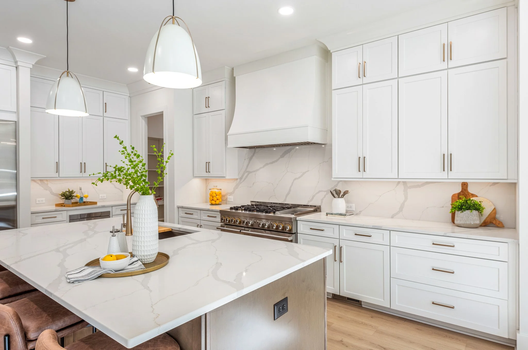 Staged kitchen with marble backsplash and gold hardware, Charlotte NC