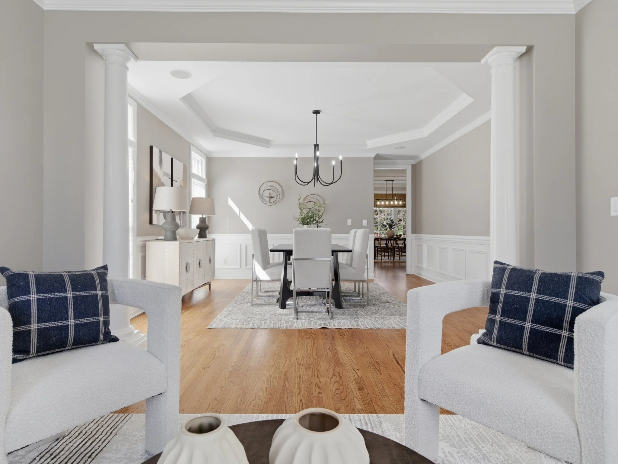 Staged sitting room with swivel chairs open to dining room, Charlotte NC