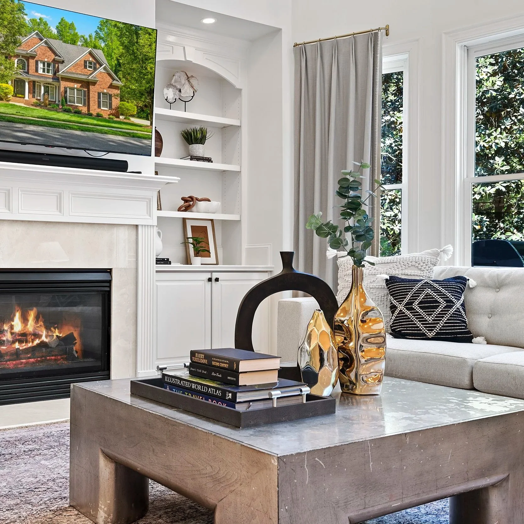 Staged living room with curated decor and built-in shelving