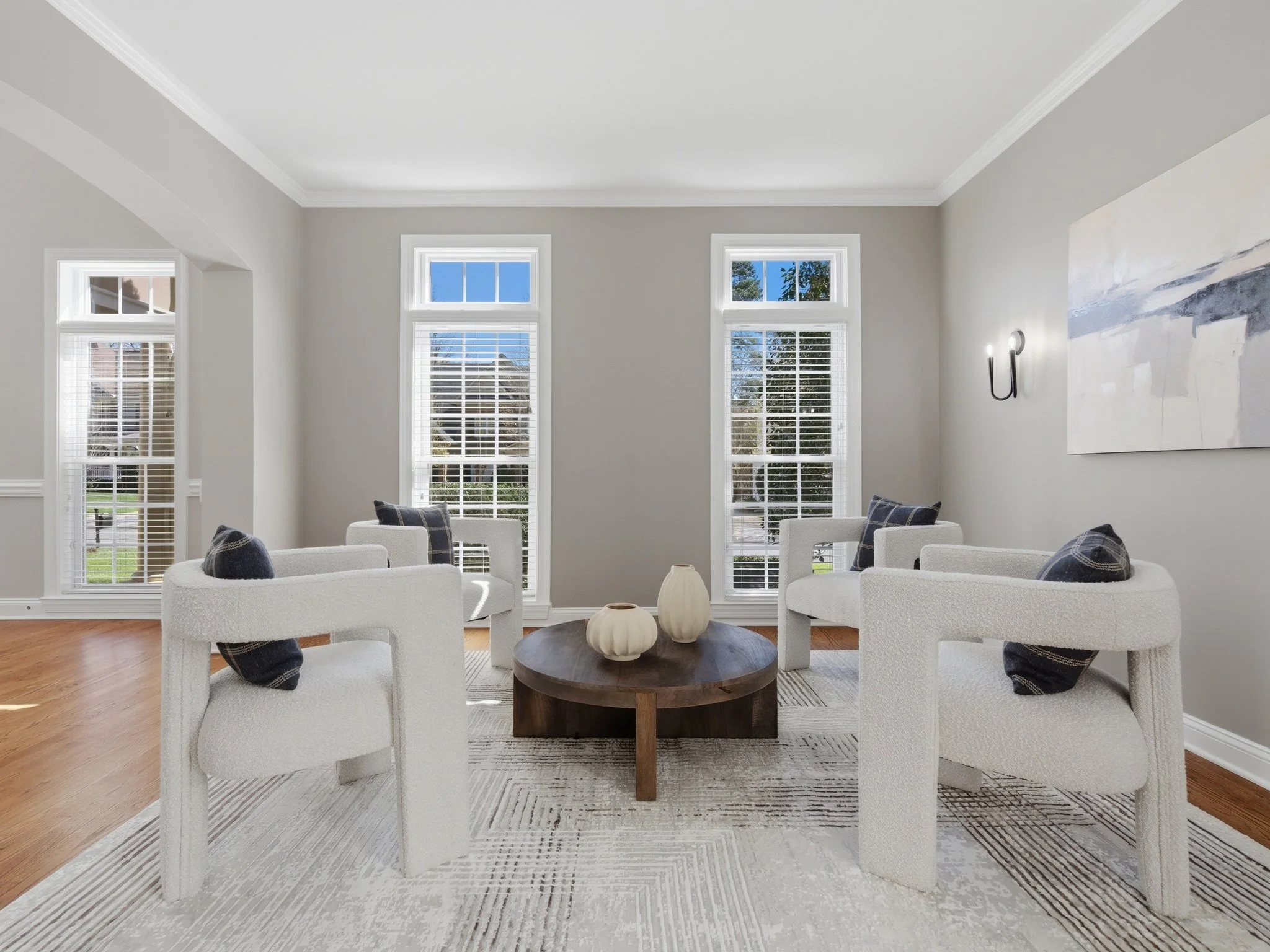 Staged sitting room with boucle chairs and round coffee table, Charlotte NC