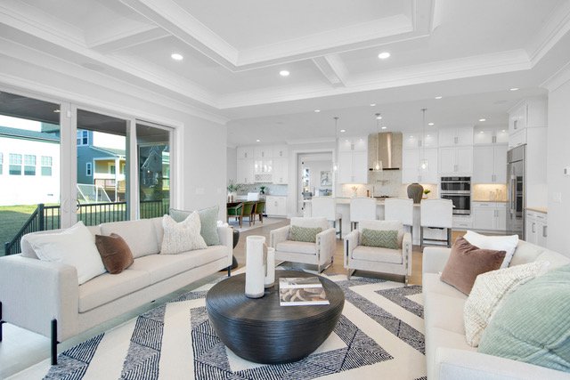 Staged sitting room open to kitchen with coffered ceiling, Charlotte NC