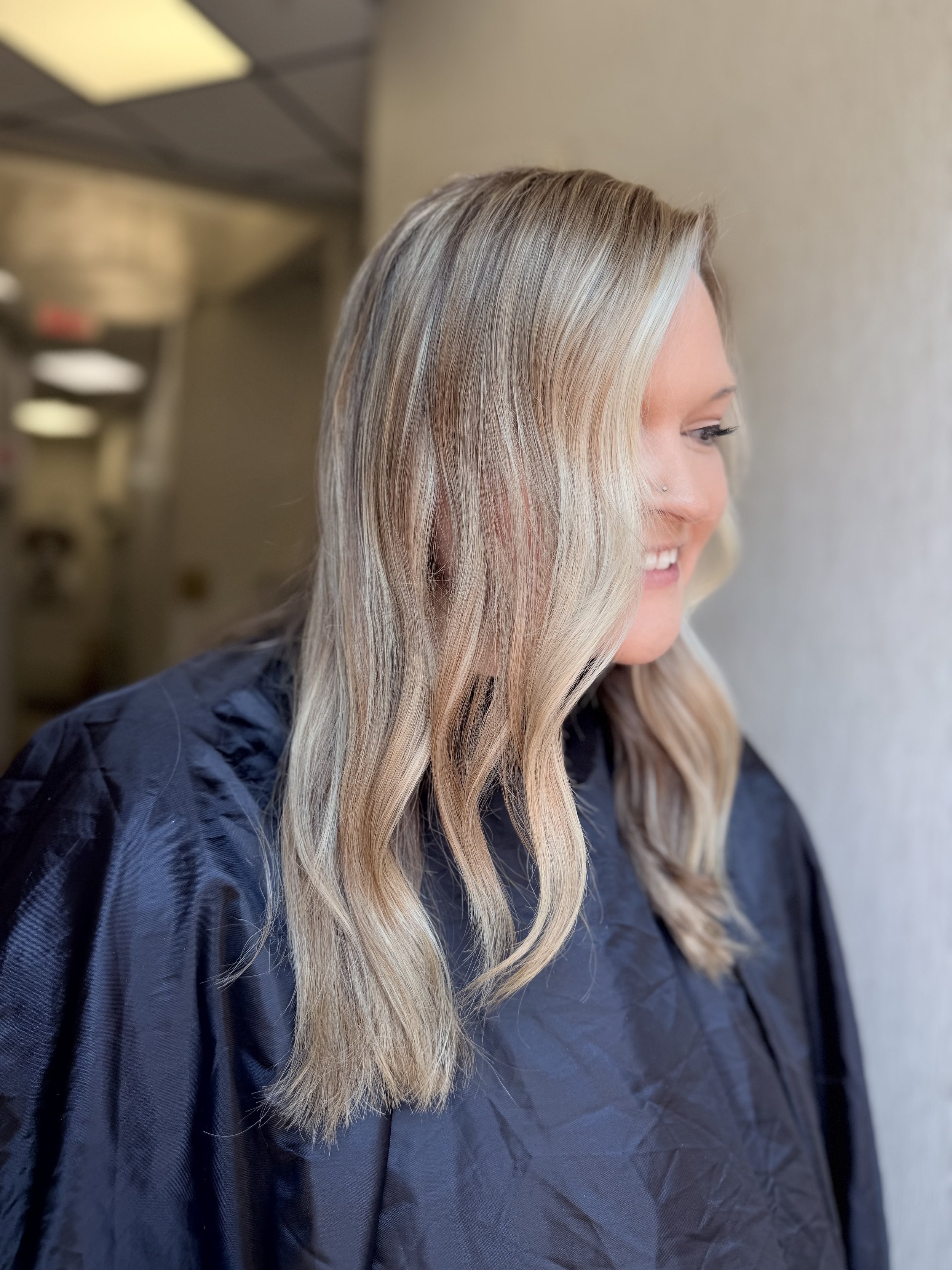 Bright dimensional blonde hair transformation by VIP Hair Co. in Bentonville