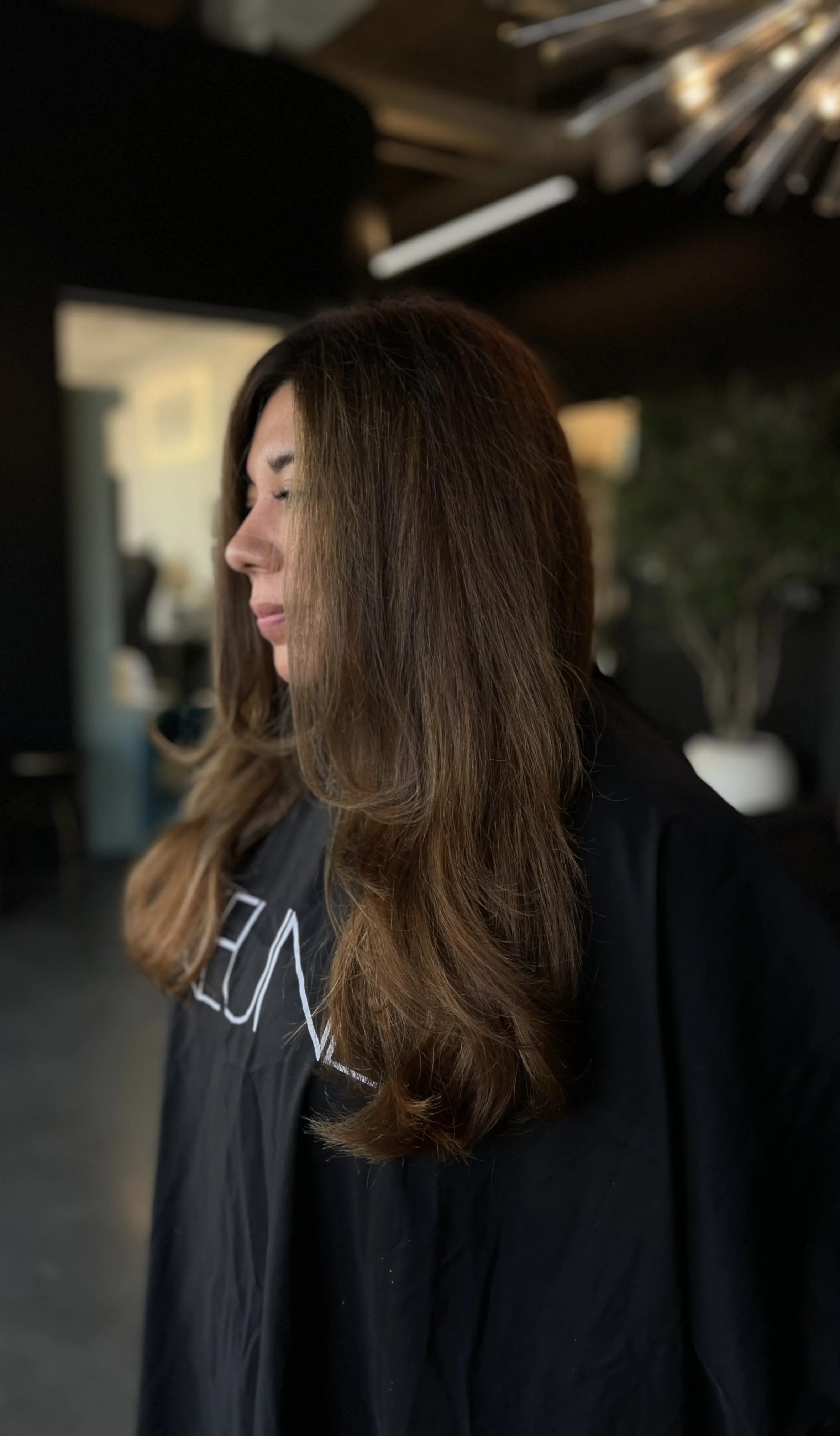 A layered haircut with a bouncy, voluminous blowout at VIP Hair Co. in Bentonville, Arkansas