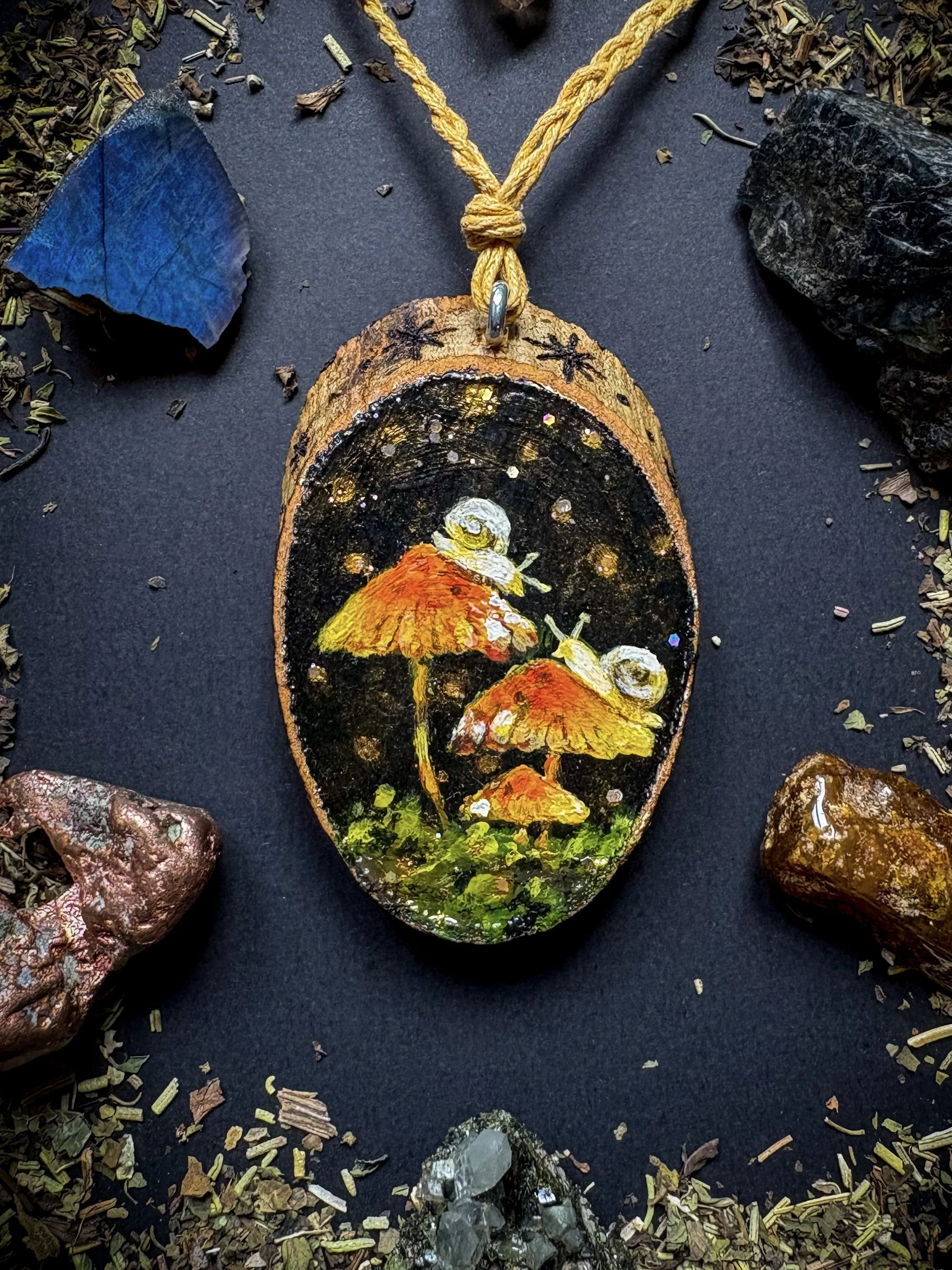 "Evoking Autumn"  
Talisman Pendant - Acrylic painting with glitter on wood.    
Magic is never a distant place or a lost secret; it is a silent breath that lives in all things, a subtle pulse that belongs to us. Autumn, with its golden silences, its