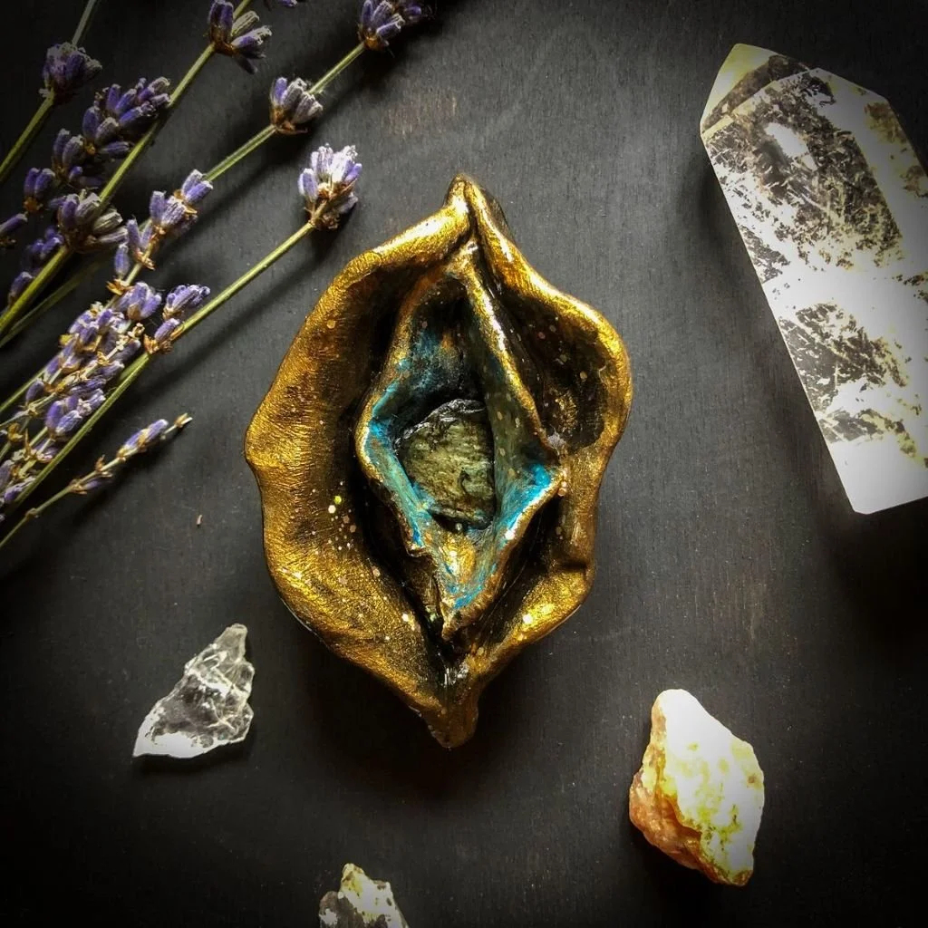 "Sacred Yoni"  
Clay sculpture, acrylic paint, serpentinite stone and glitter.