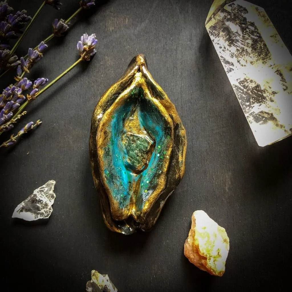 "Sacred Feminine Yoni"   Clay sculpture, acrylic paint, serpentinite stone and glitter.